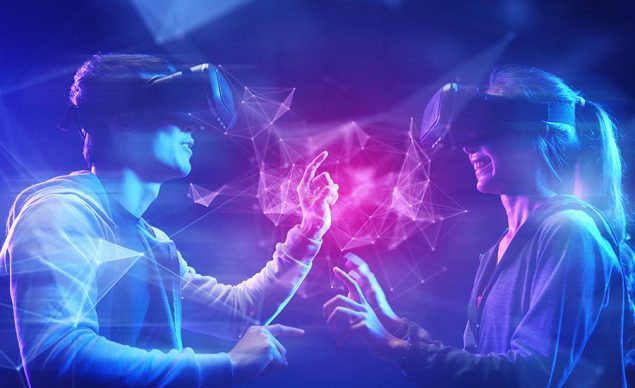 An image showing two people wearing VR headsets, fully immersed in a virtual world. Image used in the “Metaverse Gaming: The Beginner’s Guide For 2022” blog post.​